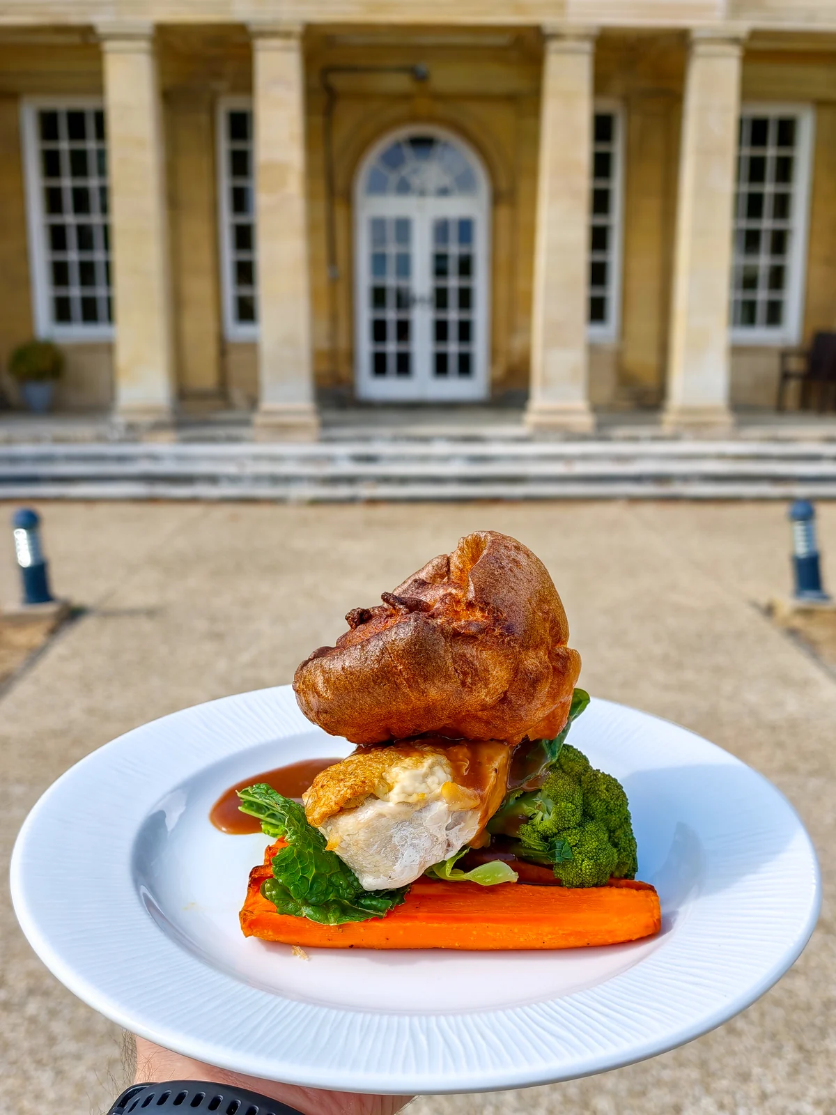 Chicken with a Yorkshire pudding, roasted carrot and greens