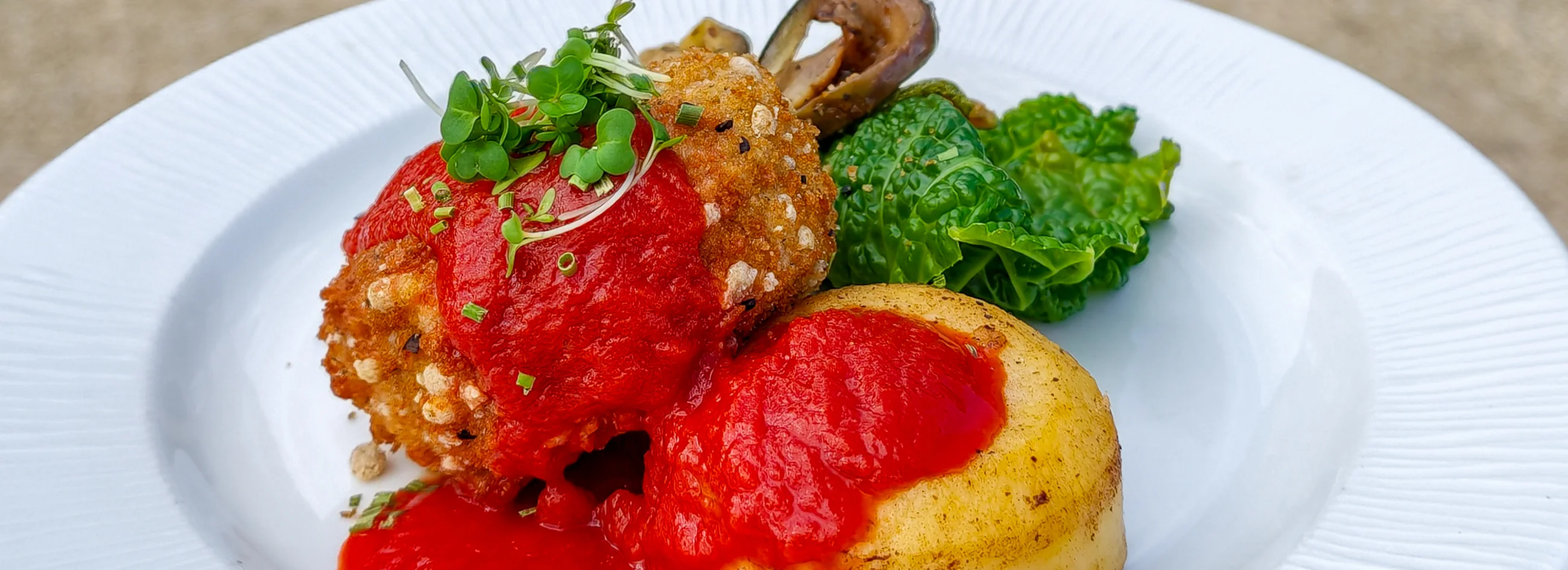 Chicken with a Yorkshire pudding, roasted carrot and greens
