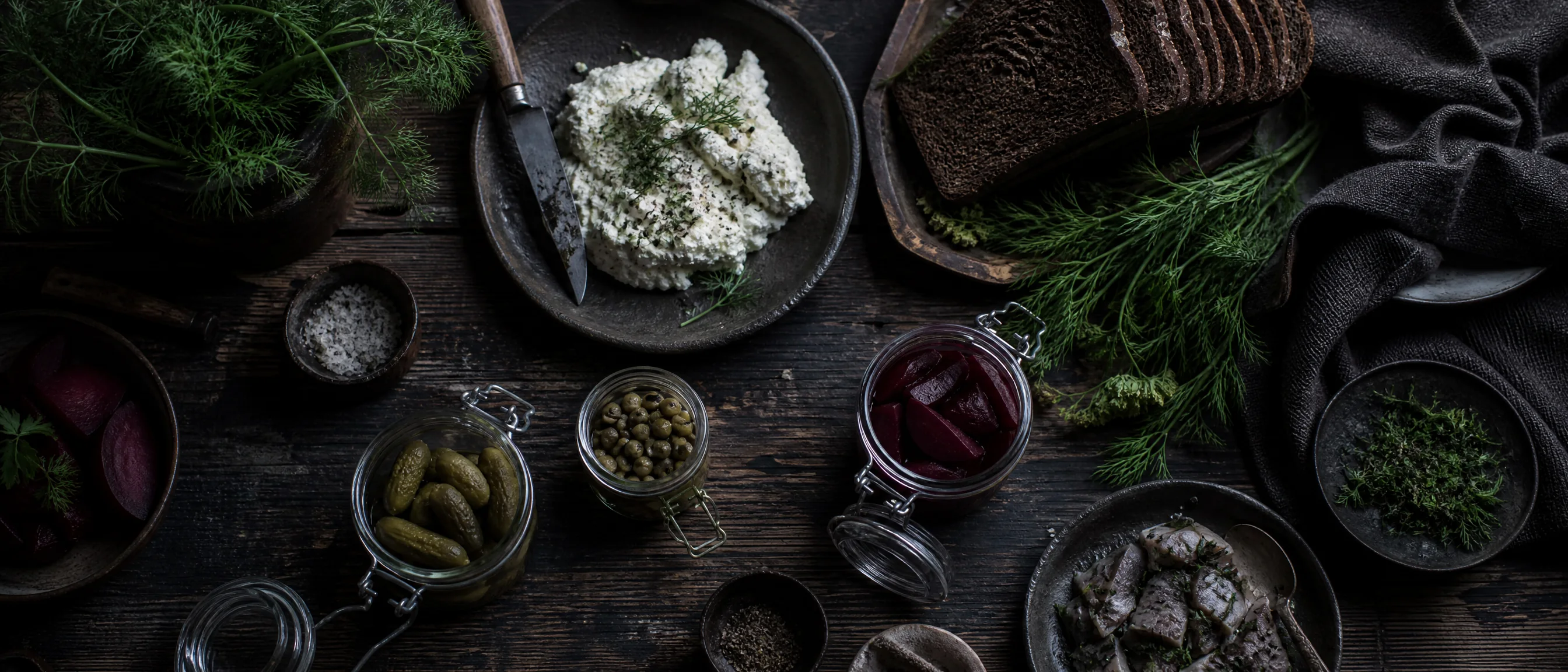 Placeholder image — Northern European food on a dark wooden table